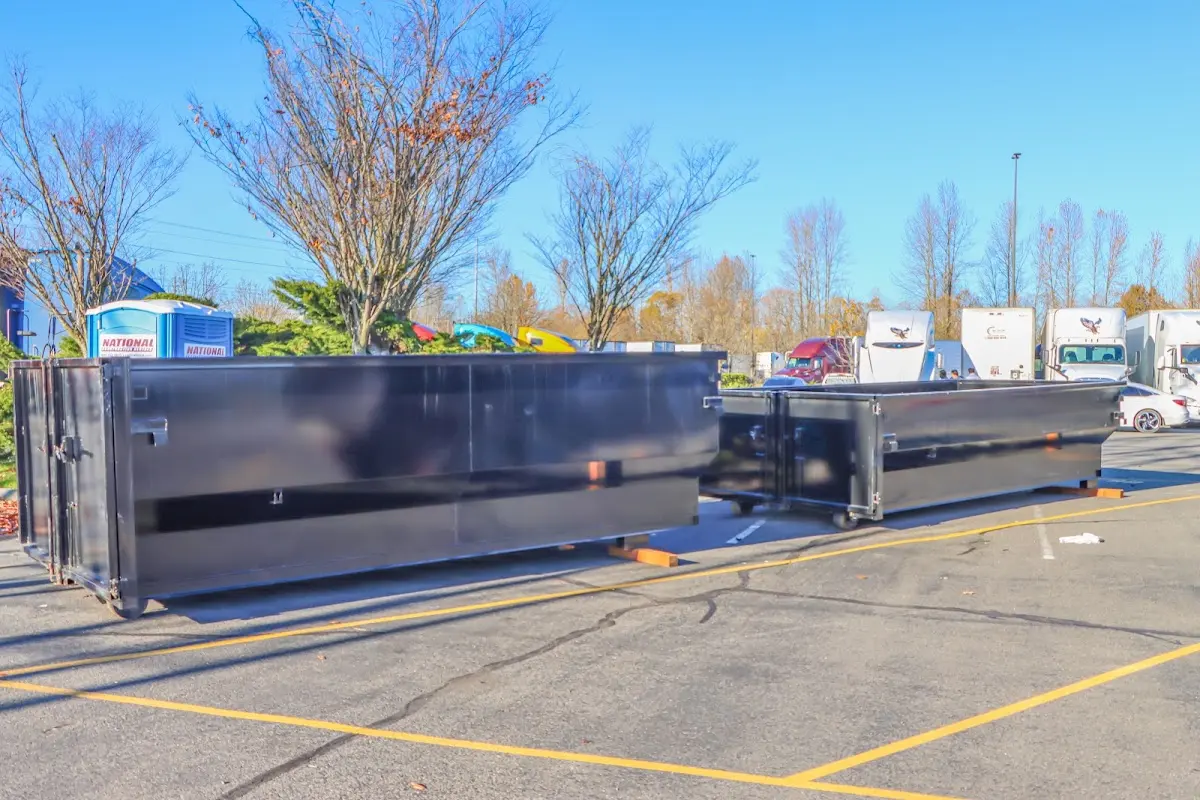 Professional dumpster rental service with roll-off container on residential driveway in Linda